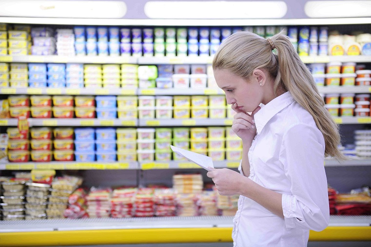 woman reading her shopping list in the supermarket